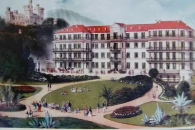 a painting of a building with people in a park at Le Pavillon113 in Cannes