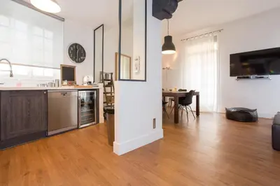 a living room with a kitchen and a dining room at Suquet Sea Cannes in Cannes