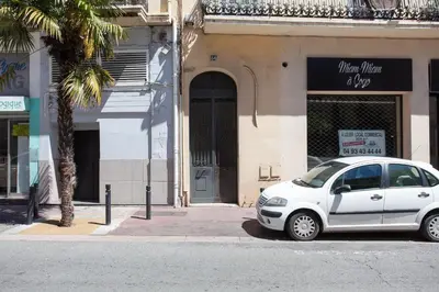 a white car parked in front of a building at Suquet Sea Cannes in Cannes