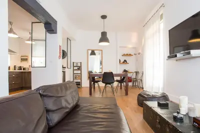 a living room with a couch and a table at Suquet Sea Cannes in Cannes