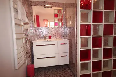 a bathroom with a white sink and a mirror at From Hollywood to Bollywood 2 Bedrooms 2 Bathrooms - 1 min from Croisette&Beach, 12 Min from the Palais in Cannes