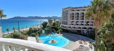 a view of the beach from the balcony of a hotel at #Cannes Boccacabana Beach, Seafront, in Résid Pierre&Vacances Classé 3 Stars in Cannes