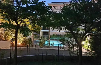 a swimming pool lit up at night at Secret Garden in Cannes