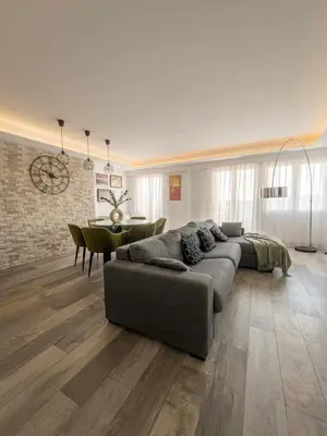 a bedroom with a large white bed in a room at Palladium Palais des Festivals in Cannes