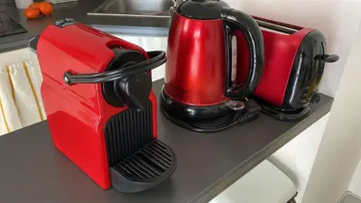 a red blender sitting on top of a counter at Le Petit Magellan in Cannes