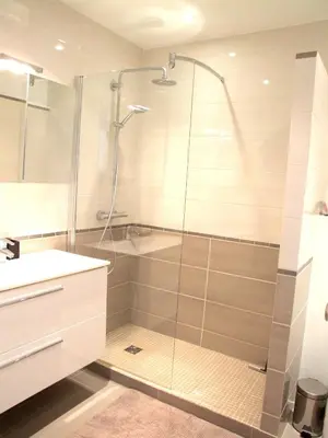 a bathroom with a shower and a tub and a sink at Le Petit Magellan in Cannes