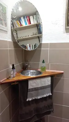 a bathroom with a sink and a mirror at Agréable chambre d'hôte à 50M de la mer in Cannes