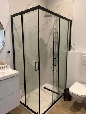 a shower with a glass door in a bathroom at Touchlux apartments in Cannes