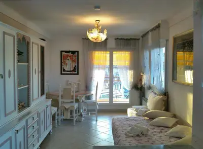 a living room with a couch and a table at Boite d'Amour in Cannes