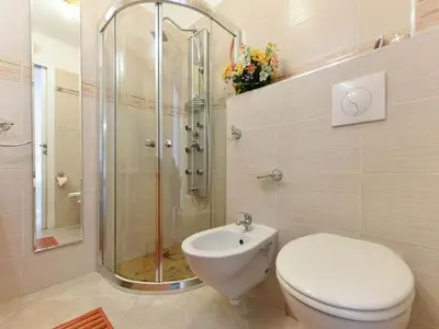 a bathroom with a shower and a toilet and a sink at Boite d'Amour in Cannes