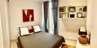 a bedroom with a bed in a room at Apartment 3 Pieces in Cannes