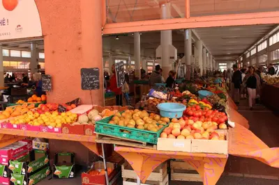 a market with many fruits and vegetables on display at Résidence Le Président - Forville in Cannes