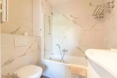 a bedroom with a bed with two towels on it at Apartment 2 bedrooms2 bathroomsdouble terrace & Garden in Palm beach area in Cannes