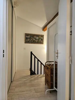 a hallway with a staircase and a painting on the wall at SUQUET - BEACH 100m & PALAIS DES FESTIVALS 600m in Cannes