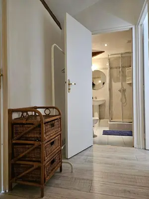 a bathroom with a walk in shower and a sink at SUQUET - BEACH 100m & PALAIS DES FESTIVALS 600m in Cannes