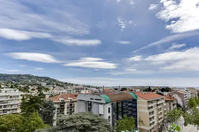 a view of a city with buildings and trees at IMMOGROOM - Apartment with terrace - AC - Parking in Cannes