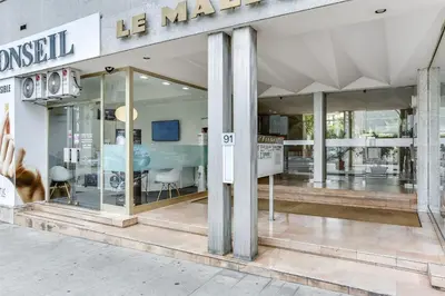 a store front of a mall with glass windows at IMMOGROOM - Apartment with terrace - AC - Parking in Cannes