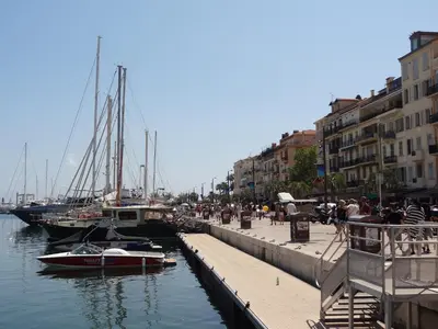 a marina with boats and people on a dock at VUE MER - Appartement T2 in Cannes