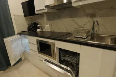 a kitchen with a sink and a counter top at Delaup Sea Cannes in Cannes