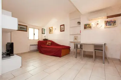 a living room with a couch and a table at Frères Suquet Sea Cannes in Cannes