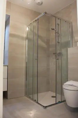 a shower stall in a bathroom with a toilet at Eve in Cannes