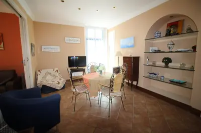 a living room with a table and chairs at AGENCIA appartement Rue d'Antibes in Cannes