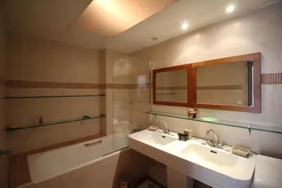 a bathroom with a sink and a bath tub at AGENCIA appartement Rue d'Antibes in Cannes