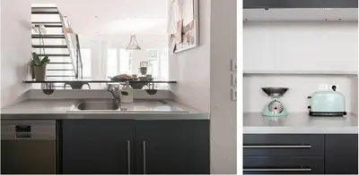 a kitchen with black cabinets and a sink at Central Cannes Loft - 15 min Palais des Festivals in Cannes