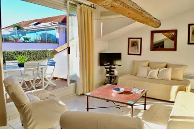 a living room with a couch and a table at Le Napoléon 3P SAM1437 in Cannes