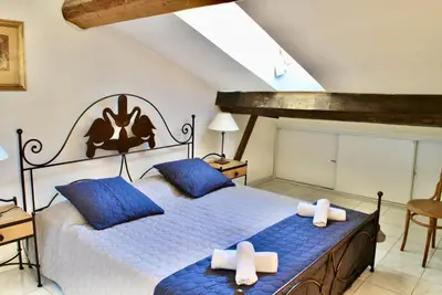a bedroom with a bed with blue sheets and blue pillows at Le Napoléon 3P SAM1437 in Cannes