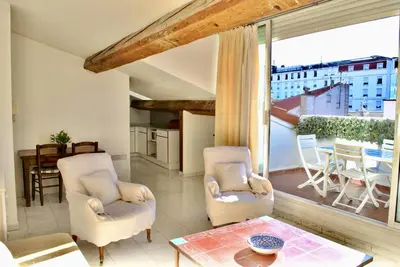 a living room with two chairs and a large window at Le Napoléon 3P SAM1437 in Cannes