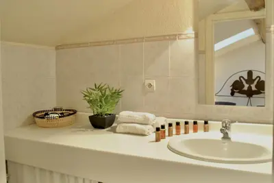 a bathroom counter with a sink and a mirror at Le Napoléon 3P SAM1437 in Cannes