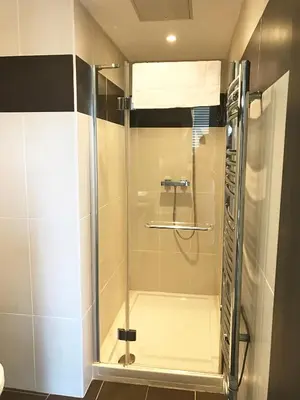 a shower with a glass door in a bathroom at Cannes Festival in Cannes