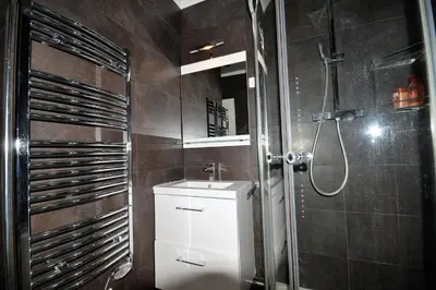 a bathroom with a shower and a toilet and a sink at Palais Rouaze Cannes in Cannes
