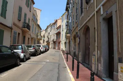 a street with cars parked on the side of the road at Cosy-Cocoon in Cannes