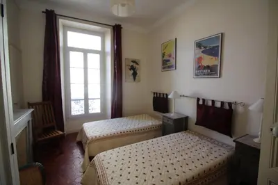 a bedroom with two beds and a window at AGENCIA apartement 3 PIECES RUE D'ANTIBES in Cannes