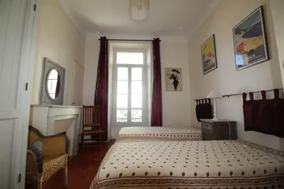 a bedroom with two beds and a window at AGENCIA apartement 3 PIECES RUE D'ANTIBES in Cannes