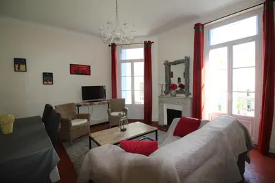 a living room with a couch and a table at AGENCIA apartement 3 PIECES RUE D'ANTIBES in Cannes