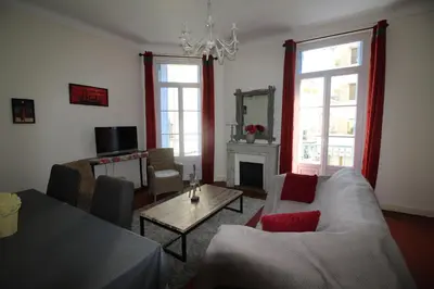 a living room with a couch and a table at AGENCIA apartement 3 PIECES RUE D'ANTIBES in Cannes