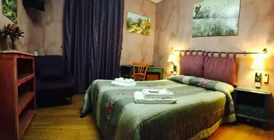 a bedroom with a bed with two towels on it at Boutique Hotel Couleurs Suds in Cannes