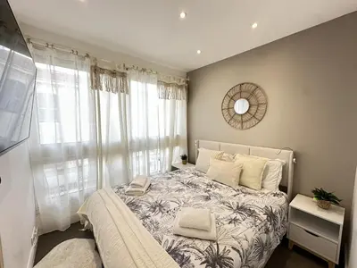 a bedroom with a bed and a window at Cannes center perfect 3 bedroom in Cannes