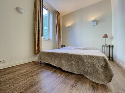 a bedroom with a bed and a large window at Le Saint-Pierre PET231 2P in Cannes