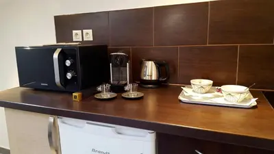 a kitchen counter with a microwave and two cups at Cannes,croisette,palais des festivals,plages in Cannes