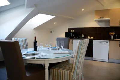 a dining room with a table with wine glasses at Cannes,croisette,palais des festivals,plages in Cannes