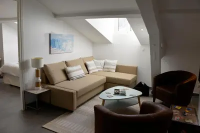 a living room with a couch and a table at Cannes,croisette,palais des festivals,plages in Cannes