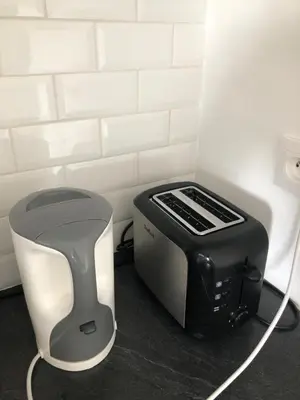 a toaster and a toaster sitting on a counter at Amazing Studio Cannes Center - Terrassse - 5 min Croisette in Cannes