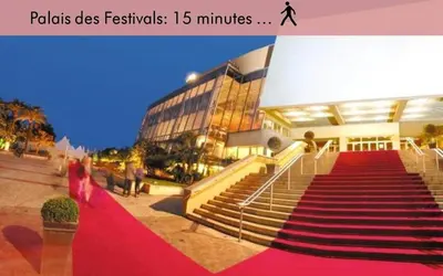 a building with a red carpeted staircase in front of a building at Amazing Studio Cannes Center - Terrassse - 5 min Croisette in Cannes