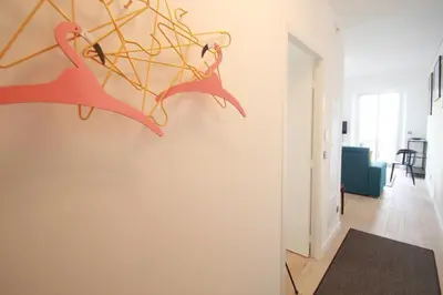 a room with a wall with pink birds on it at Palais Foch in Cannes