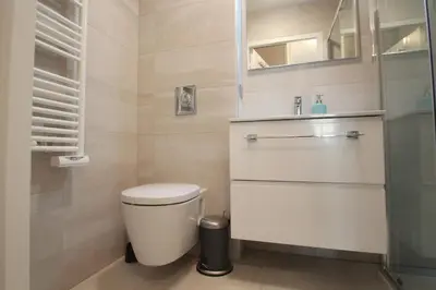 a bathroom with a toilet and a sink at Palais Foch in Cannes