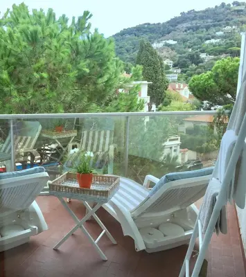 a balcony with two chairs and a table with a view at Appartements Cannes in Cannes
